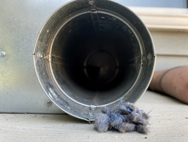Pickerington Dryer Vent Cleaning technician using specialized equipment to clear severe dryer vent blockage in Pickerington